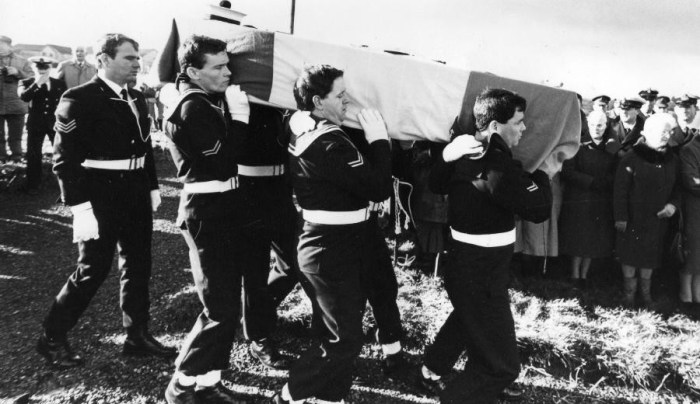 Comrades bear the coffin of L/Sea Michael Quinn DSM at his funeral with full military honours