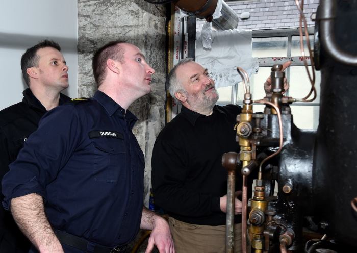 PO/ERA Duggan, PO/ERA O'Hara and Mr Paul Evans with the engine