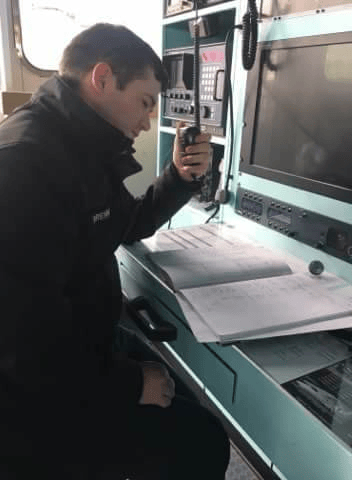 A/CommOp Tristan Brennan in the Main Communications Office